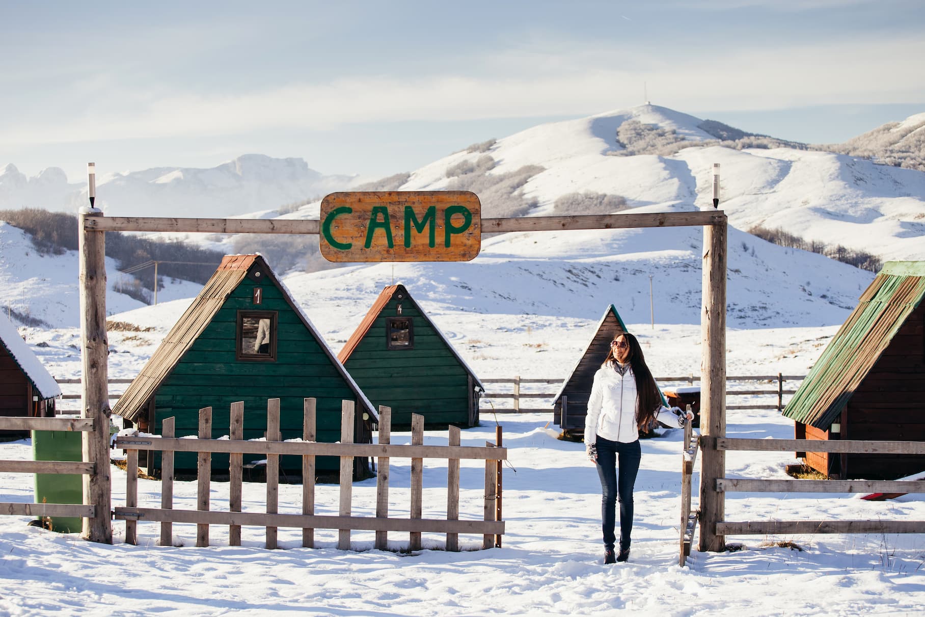 woman-play-with-snow-at-ski-resort-camp-2024-12-02-21-08-05-utc (1)